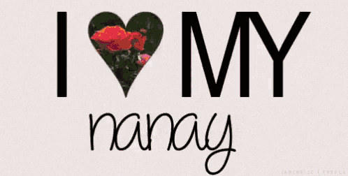 a sign that says `` i love my madre '' with a heart made of roses