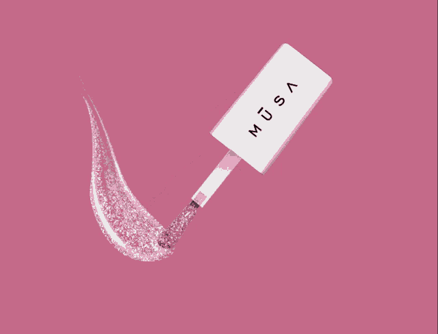 a bottle of musa lip gloss with a pink background