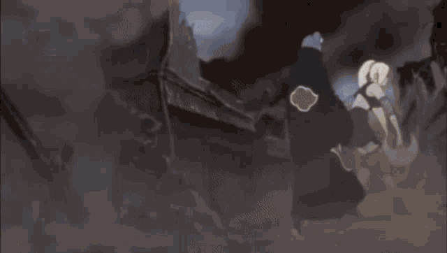 a man and a woman are fighting each other in a room .