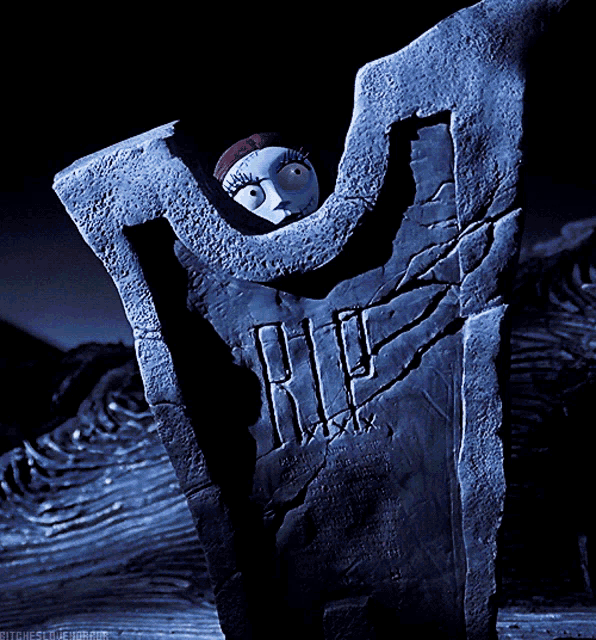 a nightmare before christmas scene with sally on a tombstone
