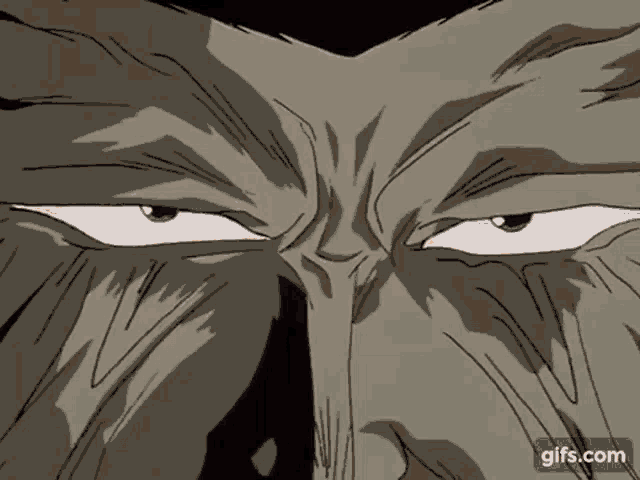 a close up of a cartoon character 's face with a very angry look on his face .