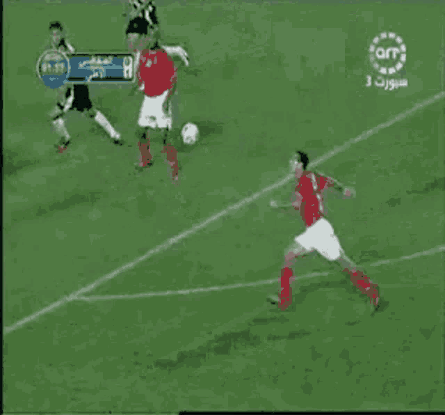 a soccer goalie is diving to catch a ball in front of a sign that says sports