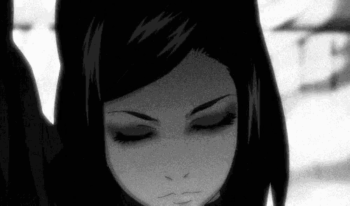 a black and white photo of a girl with her eyes closed and a serious look on her face .