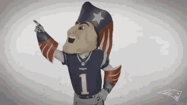 a mascot for the new england patriots is wearing a hat and pointing at something .