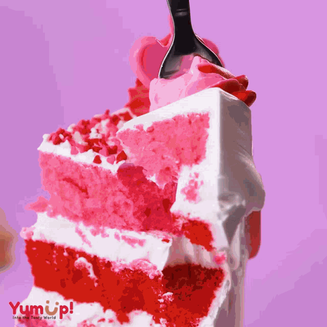 a slice of cake is being eaten with a fork and the word yum up is on the bottom