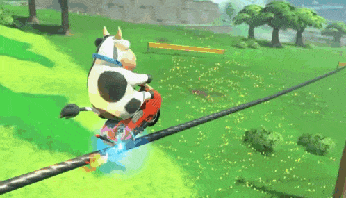 a cartoon cow is riding a motorcycle down a road .