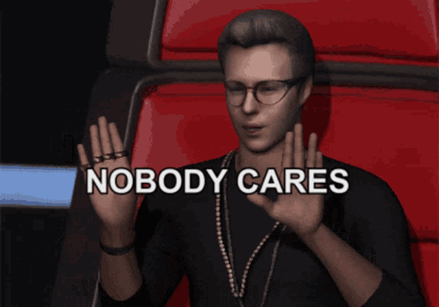 a man sitting in a red chair with his hands up and the words nobody cares above him