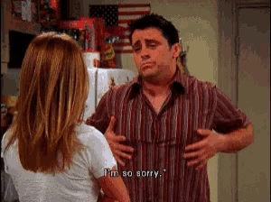 a man in a striped shirt says " i 'm so sorry " to a woman