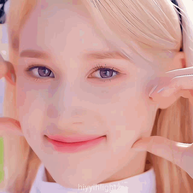 a close up of a woman 's face with the hashtag hiyyillightz on the bottom right