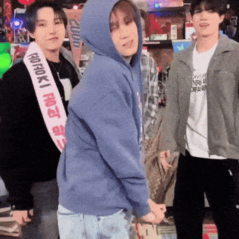 a man in a blue hoodie has a sash around his neck that says ' prorok ' on it