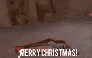 a cartoon reindeer is standing in the snow with the words `` merry christmas '' written on it .
