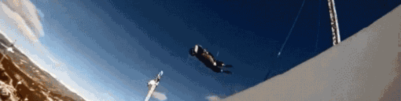a person is flying through the air on a rope