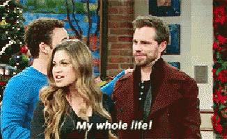 a man and woman are standing next to each other and the woman says my whole life
