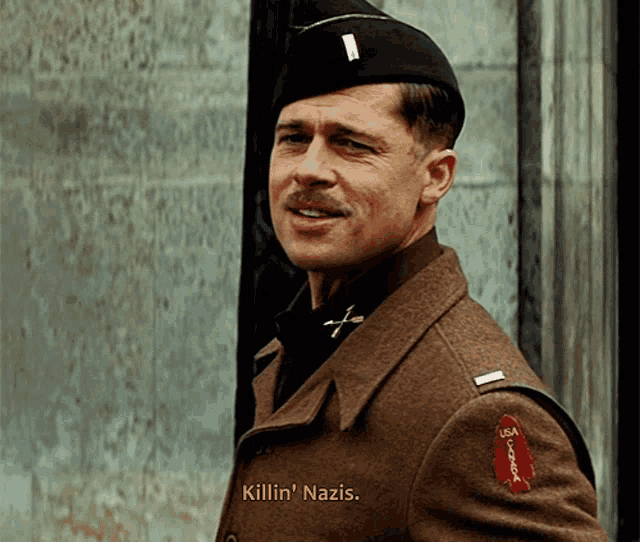 a man in a military uniform says killin ' nazis on the screen