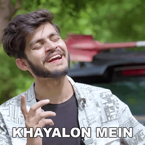 a man with a beard is making a funny face with the words khayalon mein written below him