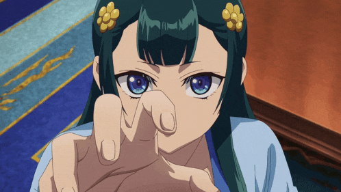 a close up of a girl with blue eyes making a funny face