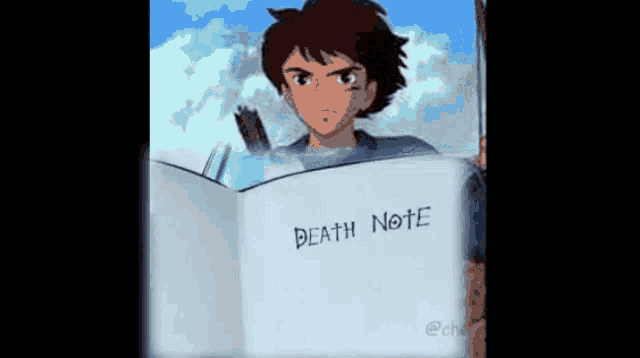 a boy is holding a book titled death note .