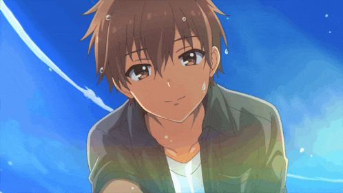 a boy with brown hair and a white shirt looks at the camera