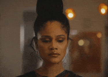 a close up of a woman 's face with earrings on