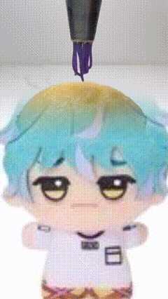 a doll with blue hair and a white shirt with the number 8 on it 's chest