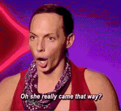 a woman wearing a red tank top and a purple scarf says oh she really came that way