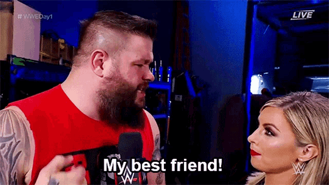 a man is talking to a woman in front of a microphone and says my best friend .