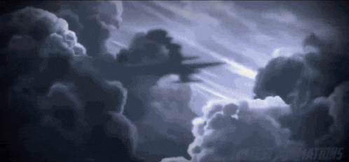 a plane is flying through a cloudy sky at night