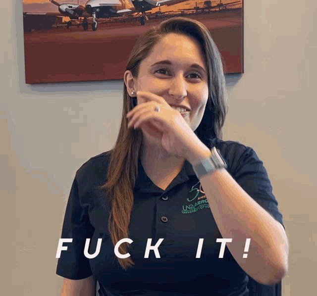 a woman in a black shirt with the word fuck it on the bottom