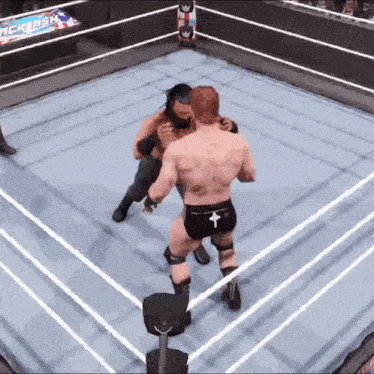 two men are wrestling in a wrestling ring with a banner that says ' rclash ' on it
