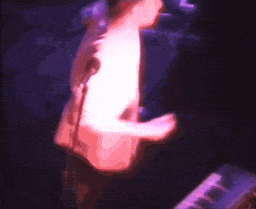 a blurry picture of a person playing a keyboard