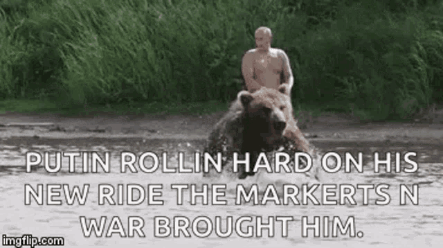 a man is riding on the back of a bear .
