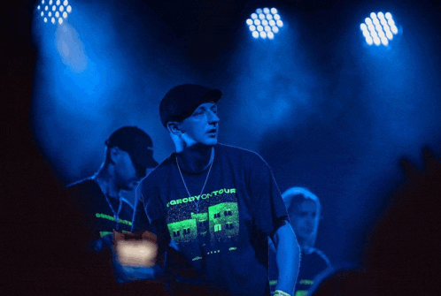 a man wearing a shirt that says grodyck tour on it