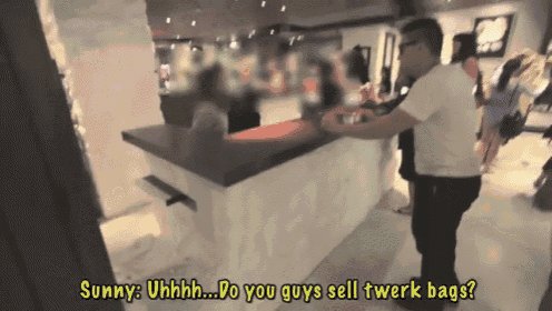 a man standing in front of a counter with the words sunny uhhhh do you guys sell twerk bags below him