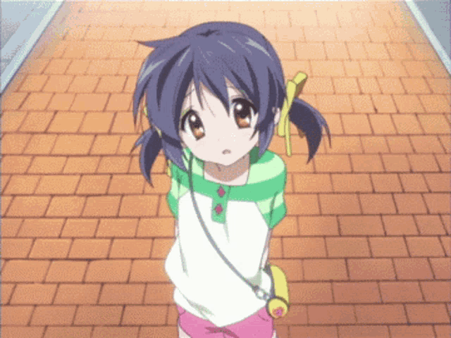 a little girl with purple hair stands on a brick sidewalk