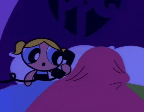 a couple of cartoon characters sitting on a bed