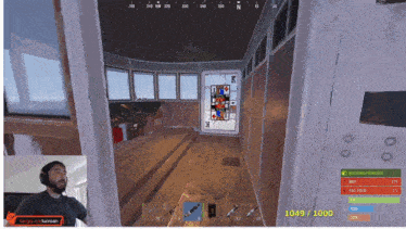 a man playing a video game with the number 1049/1000 on the screen