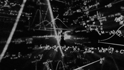 a blackboard filled with mathematical equations and graphs