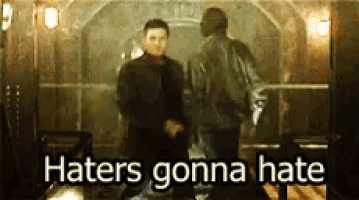 two men standing next to each other with the words haters gonna hate written on the bottom