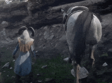 a man with horns is standing next to a white horse
