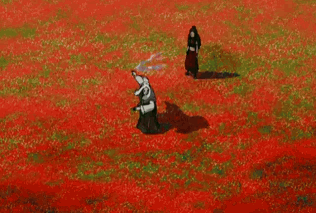 a man and a woman are standing in a circle in a field .