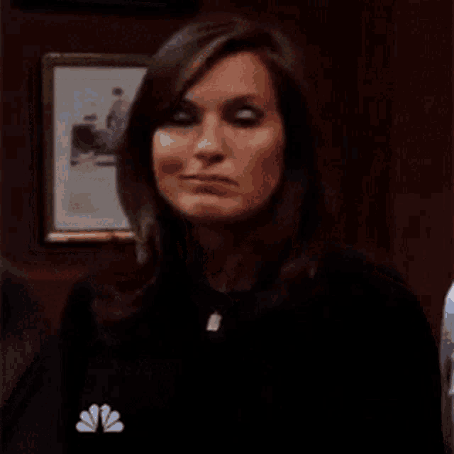a woman is talking to a man and says are you kidding me .