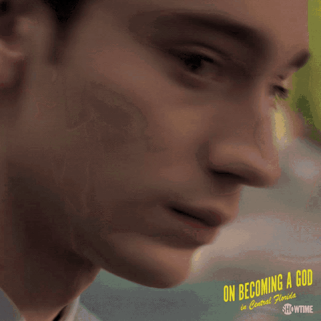 a close up of a person 's face with the words on becoming a god in central florida on the bottom