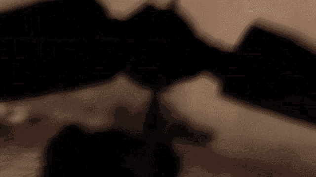 a person is holding a knife in a foggy field