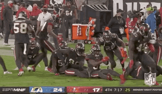 a football game is being played between the tampa bay buccaneers and the arizona cardinals .