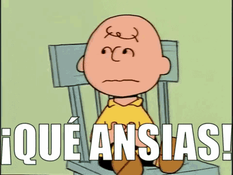 a cartoon of charlie brown sitting in a chair with the words i que ansias ! written below him .