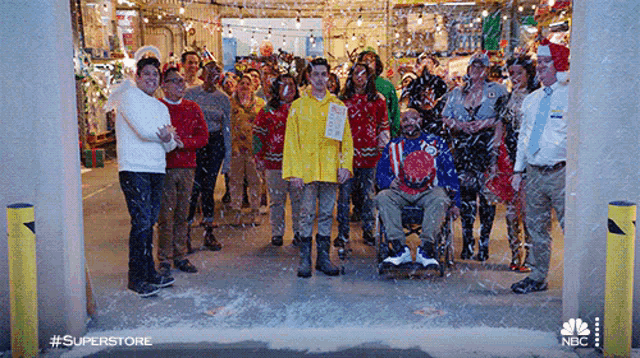 a group of people are posing for a picture with the hashtag #superstore on the bottom