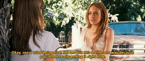 two women are standing next to each other and one of them is saying okay see i tried being nice