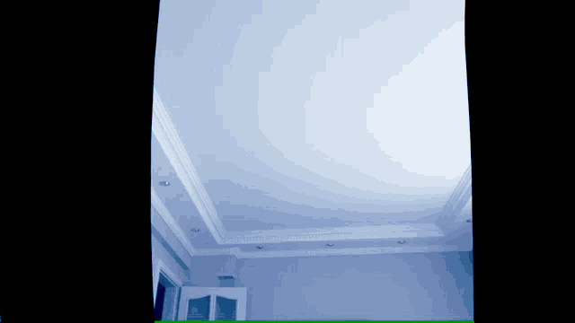 a blue room with a white ceiling and a door