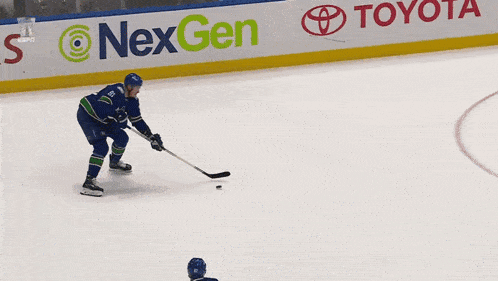 a group of hockey players are on the ice and one of them has the number 23 on his jersey