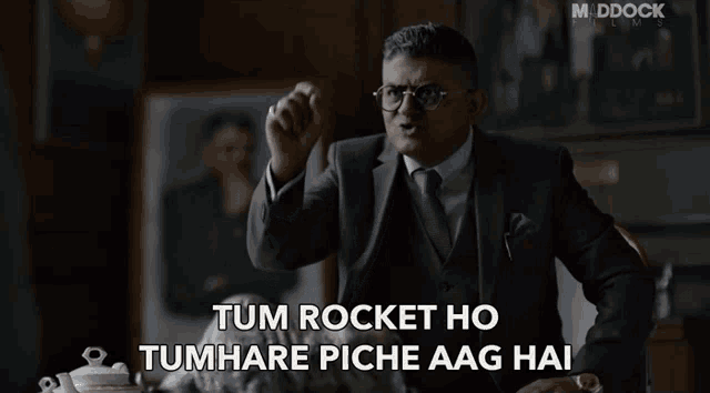 a man in a suit and tie says tum rocket ho
